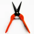 Compact craft and gardening wire snips with orange handles, spring-loaded design for easy cutting. - Korean Long Scissors