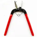 Mini metal punch pliers with red handles for DIY craft jewelry making and leather work. - Punch Pliers