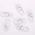 White metal swivel snap hooks and keychain clips, durable hardware for bags and lanyards. - White