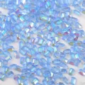 Close-up of light blue aurora rectangle nail rhinestones, ice block charm details. - Ice Transparent Aqua Blue