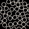 Close-up detail of metal jump rings for jewelry making, DIY handmade connector findings. - 0.5x3mm Welded Closed Jump Rings / Thick Silver Plated