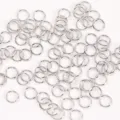 Silver metal jump rings detail shot for DIY jewelry making, bracelet and necklace connector. - 0.5x3mm / Real Gold Plated