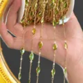 Detailed view of DIY gold-tone chain with green marquise stones for jewelry making. - Green KC Gold