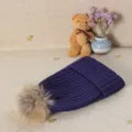 Dark purple winter knitted beanie hat with fluffy fur pom pom, warm and cozy casual accessory. - Navy Blue