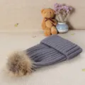 Women's grey knitted beanie hat with fluffy fur pom pom, winter thick warm casual solid color pull-on cap. - Dark Gray