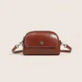 Vintage oil-wax leather crossbody bag for women, retro dome shell design with metal snap. - Brown
