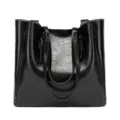 Detail view of large capacity black oil leather tote bag with dual handles and zippers. - Black