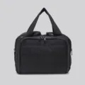 Black quilted cosmetic bag, lightweight waterproof travel handbag and portable storage organizer. - Black