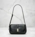 Retro black shoulder bag for women, chic saddle bag with turn-lock and elegant contrast stitch. - Black