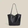 Black lychee grain leather shoulder bucket bag with metal grommets and rivet strap design - Black