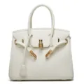 White leather handbag for women, classic lock tote bag with gold hardware and top handle. - White