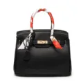 Black pebble leather handbag with gold lock and stylish scarf wrapped handle for women. - Black