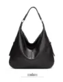Detailed view of black leather hobo shoulder bag texture, hardware ring and casual design. - Black