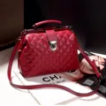 Red quilted boston handbag with metal frame lock, stylish shoulder crossbody bag for women. - Argyle Red