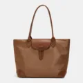 Classic brown nylon tote bag with leather handles and flap closure for women commuting daily. - Tan