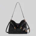 Black suede shoulder bag with chic lock buckle and cute dog charm for vintage style. - Black