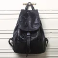 Black leather backpack for women, soft PU school rucksack with drawstring and flap closure design. - Black