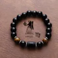 Zodiac bracelet featuring black obsidian beads, tiger eye stone, and Virgo charm detail. - Virgo