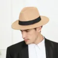 Detailed shot of a classic khaki fedora hat featuring a stylish black band and wide brim. - M (56-58cm) / Camel
