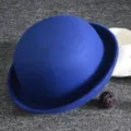 Blue wool felt bowler hat detail, classic British style dome fedora, close-up view. - Adult / Blue