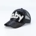 Close up of black sequin baseball cap with pearl letter baby detail breathable mesh back. - One Size / Black