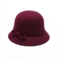 Detailed view of the elegant burgundy cloche hat featuring a cute side bow accent. - Burgundy
