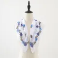 Close-up of the blue floral print chiffon square scarf showing soft fabric and fine details. - White Blue Wreath Leaves