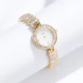 Luxury gold women watch with sparkling crystal encrusted bezel and elegant bracelet strap. - Gold