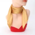 Detail view of a elegant gold silk square scarf, smooth texture for women neckerchief. - 60cm x 60cm / Gold