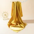 Golden satin silk scarf detail showing smooth texture and elegant drape for summer fashion. - 90cm X 90cm / Gold