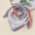 Detailed close-up shot of the colorful gradient silk square scarf and neckerchief. - Gray Pink Geometric Squares