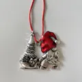 Close-up detail of silver Christmas gnome ornament with red hat and tree on sleigh. - Santa Christmas Tree