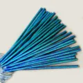 Disposable iridescent rainbow paper straws for party drinks, eco-friendly and stylish design. - Holographic Green