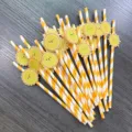 Closeup detail of cute smiling sun paper straws with yellow stripes for party decor. - Bright Orange Stripes & Smile
