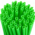 Detailed close up of vibrant green heart shaped plastic drinking straws for party supplies - 10 Pcs Per Pack / Heart Shaped Straw / Green