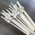 Close-up detail view of white paper straws with cute ghost cutout decorations for Halloween party. - Ghost and Pure White Straws