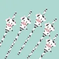 Detail view of cute cow paper straws featuring adorable animal designs for party decoration. - Classic Cow Straw