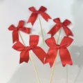 Red ribbon bow cake toppers set, swallowtail design on wooden sticks for baking party desserts. - Red