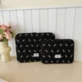 Black quilted laptop sleeve with white bow embroidery, padded tablet bag for daily use. - 11" / Black
