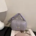 Silver quilted puff cosmetic bag, portable travel makeup storage pouch for daily use. - Purple