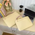 Yellow quilted laptop sleeve with pink handle, shockproof protective case for notebook and tablet. - Yellow