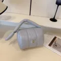 Grey quilted puffy cosmetic bag, lightweight portable travel makeup pouch with unique handle. - Gray