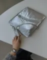 Silver Y2K metallic puffer laptop sleeve detail showing diagonal dual zipper pockets. - 11" / Silver