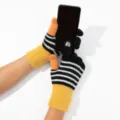 Close-up detail of touchscreen knitted gloves with colorful striped design for cold winter. - Contrast Color Plush Striped Gloves