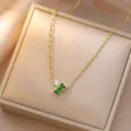 Detailed shot of retro gold square green zircon clavicle necklace, elegant jewelry design. - Square Diamond-Inlaid Necklace / Green