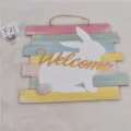Easter wooden bunny wall sign detail showing colorful pastel planks and cute fuzzy tail. - Wooden Welcome Rabbit Hanging