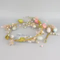 Paasdecoratie takkenslinger met kunstmatige gevlekte eieren en roze bessen 1.5m. - Stijl 06