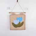 Fabric wall hanging decor featuring a cute tulip design, equipped with wooden rod and twine. - Tulip Fabric Hanging