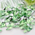 Drop-shaped green acrylic rhinestones with silver backing for DIY crafts and jewelry making. - Cyan Green