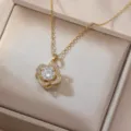 Exquisite detail view of the gold rotating four-leaf flower zircon necklace in a gift box. - Gold Rotating Clover (X0540)